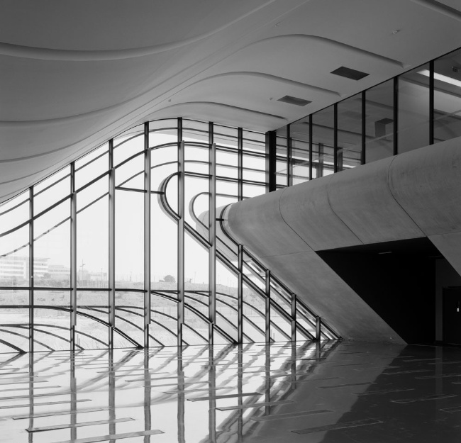 The full-height foyer contains few visible structural elements