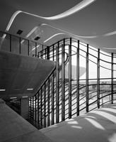The auditorium cantilevers 10m through the glazed facade to create a dramatic entrance canopy
