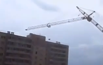 A crane crashes into a Russian housing development