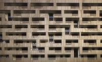 The aluminium panels create a front elevation somewhat reminiscent of a badly played game of Tetris.
