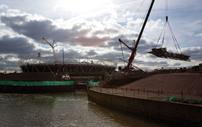 A huge road crane, normally used for erecting wind turbines, was used to lift the 36m-span bridge sections into place