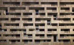 The aluminium panels create a front elevation somewhat reminiscent of a badly played game of Tetris.