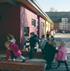 Pupils at Springhill Catholic Primary School in Southampton swarm around their new classroom block, designed by architecture plb
