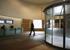 The formerly windswept entrance drum has gained glass doors and a reception desk
