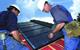 Operatives install PV 800 photovoltaic panels. Excess electricity can be sold to the National Grid
